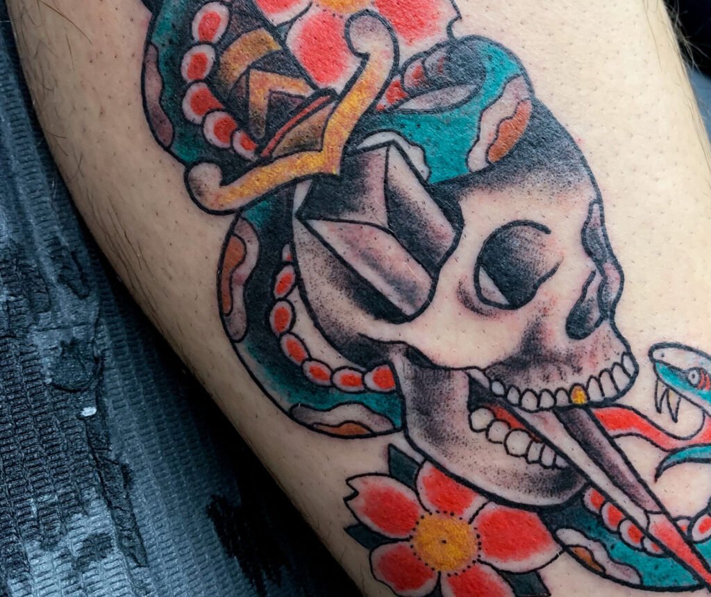 american traditional skull and dagger tattoo