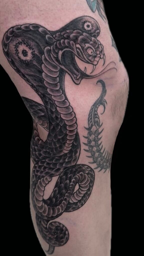 drawn on snake tattoo